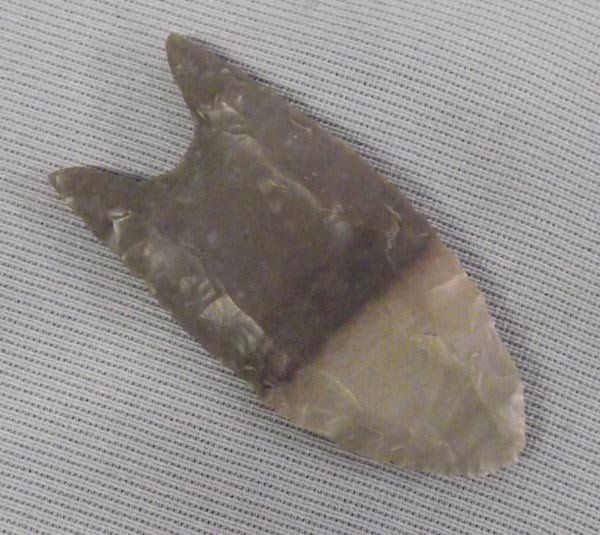 Classic Stone Arrowhead: Classic Stone Arrowhead. Origin and age unknown. Measures approx. 2 1/4''L. Buyers Pay Actual Shipping and Handling Charges(see terms and conditions for more information).