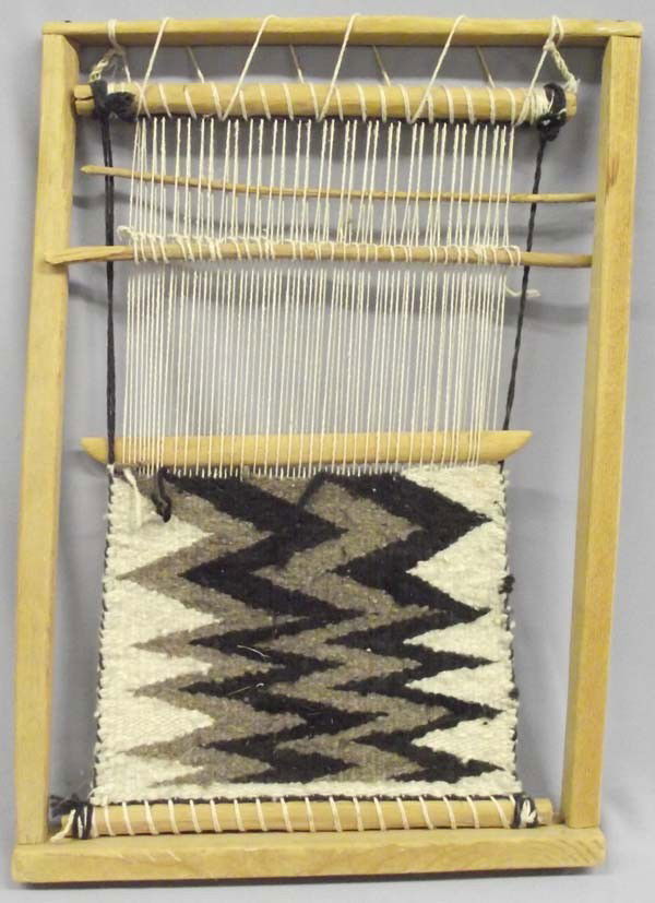 Vintage Miniature Navajo Loom With Rug: Vintage Miniature Native American Navajo Loom With Rug that is partially done. Loom measures approx. 20''H x 14 1/4''W. Buyers Pay Actual Shipping and Handling Charges(see terms and conditions for mor