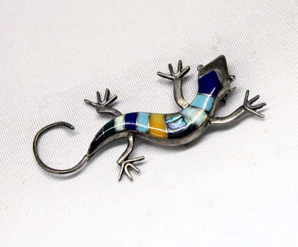 Zuni Inlaid Sterling Silver Lizard Pin w/Hallmark: Native American Zuni Inlaid Sterling Silver Lizard Pin w/Hallmark of a Lightning Bolt. Inlaid with Lapis, turquoise, coral, MOP and abalone. Measures 2.75'' head to tail. Buyers Pay Actual Shipping an