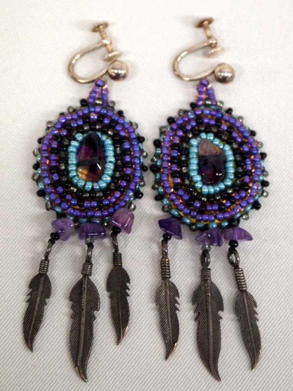 Plains Indian Beaded Sterling Silver Earrings: Beaded and Sterling Silver Southwestern Earrings. Turquoise and purple beads with silver feathers. Measures 3'' long. Leather backing. Screwback attachments. Buyers Pay Actual Shipping and Handling Ch