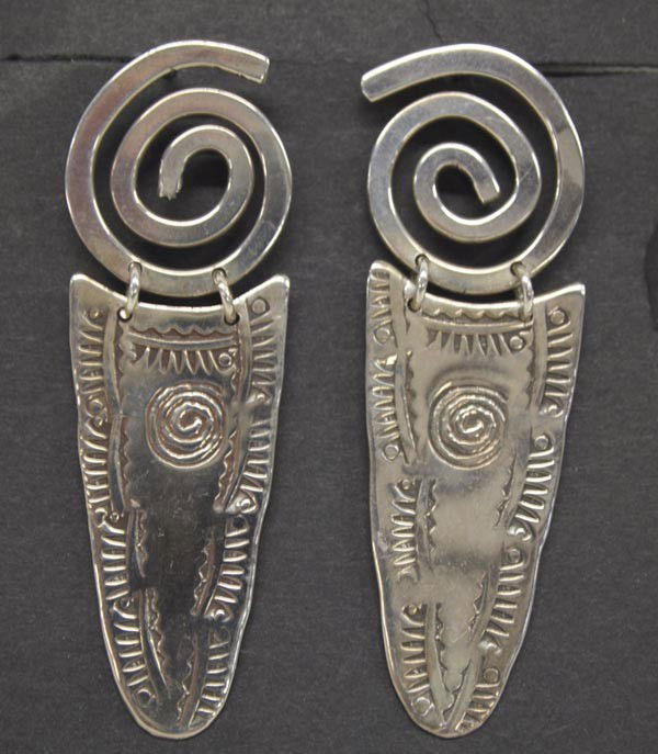 Navajo Stamped Sterling Silver Earrings: Native American Navajo Stamped Sterling Silver Earrings. Circle of Life design with hand stamped drops. Overall size is 2.25''Lx0.75''W. Post style. Buyers Pay Actual Shipping and Handling Charges(see