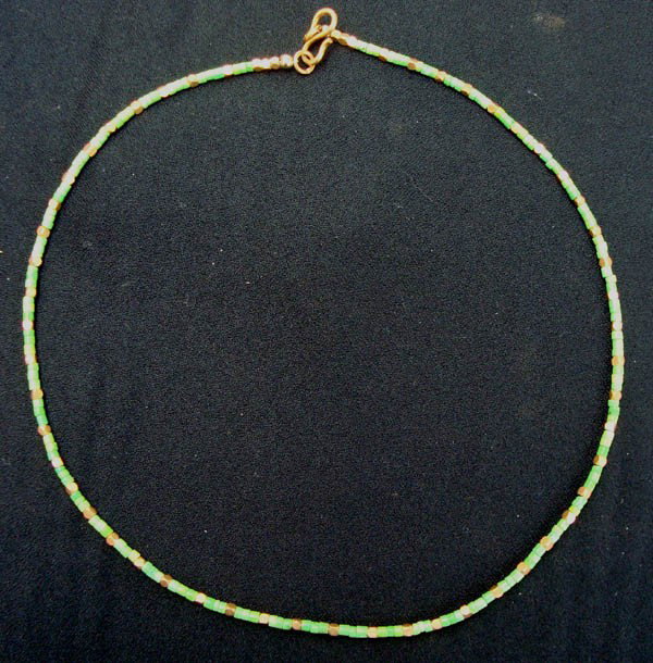 Navajo Australian Turquoise Heishi Choker Necklace: Navajo Australian Turquoise Heishi Choker Necklace. 17'' end to end. 17''L x 1/8''W. Very fine with gold tone spacers between stones. Gaspeite is said to help you plan your life and align yourself wit