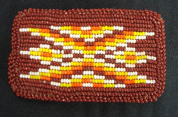 Native American Style Beaded Belt Buckle: Native American style beaded belt buckle with leather back. Approx 2.75''L x 1.5''W. Leather looks older but clean and beads in tact. Buyers Pay Actual Shipping and Handling Charges(see terms and cond