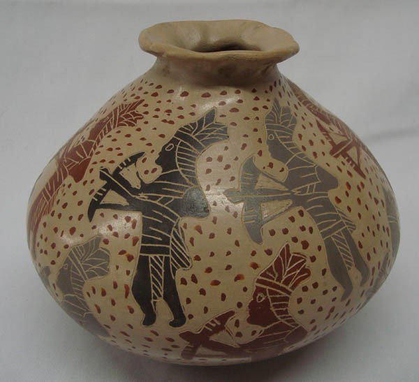 Mexican Mata Ortiz Pot- Indians, Bows & Arrows: Mexican Mata Ortiz Pot, Indians, Bows & Arrows. 5.5'' x 6.5'' diameter. Signed and hallmarked by ''Little Bird''. Some scratches, a sticker mark on bottom and irregularities on pot lip. Buyers Pay Act