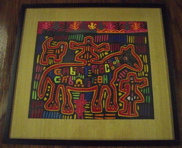 Framed Mola Man On Horse: Framed Mola of a Man On Horse. Framed with a wood frame, matted, under glass. Visual measures approx. 15 1/2''H x 18 1/2''W. Buyers Pay Actual Shipping and Handling Charges(see terms and conditions fo