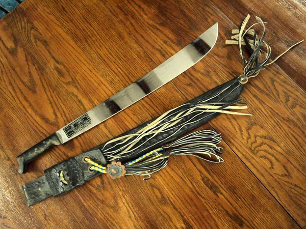 El Salvador, S.A. Corneta Machete in Scabbard: El Salvador, S.A. Corneta Machete in Scabbard. Machete measures 27.5''Lx2.25''W. The scabbard is leather and measures 26.5''Lx3.25''W. Buyers Pay Actual Shipping and Handling Charges(see terms and con