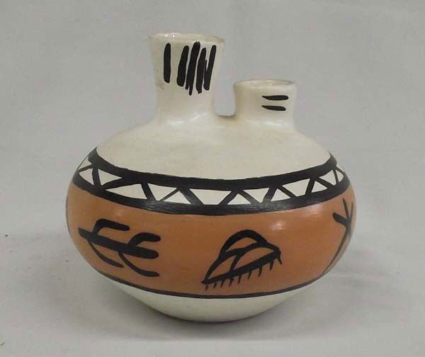 Double Spouted Polychrome Jar by Selig: Double Spouted Polychrome Jar by Selig. Jar measures 5'' x 5 1/4''. Artist signed ''Betty Selig''. Buyers Pay Actual Shipping and Handling Charges(see terms and conditions for more information).