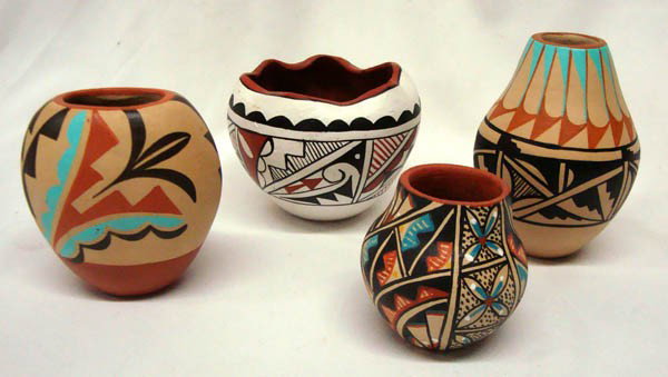 Collection Jemez Pottery: Four Native American, Jemez New Mexico Pots. Largest is 4''x3.5'' by MM Toya; other artists are MST.YA, M. Toya and MS Toya. Vibrant colors, no cracks. Buyers Pay Actual Shipping and Handling Charges(