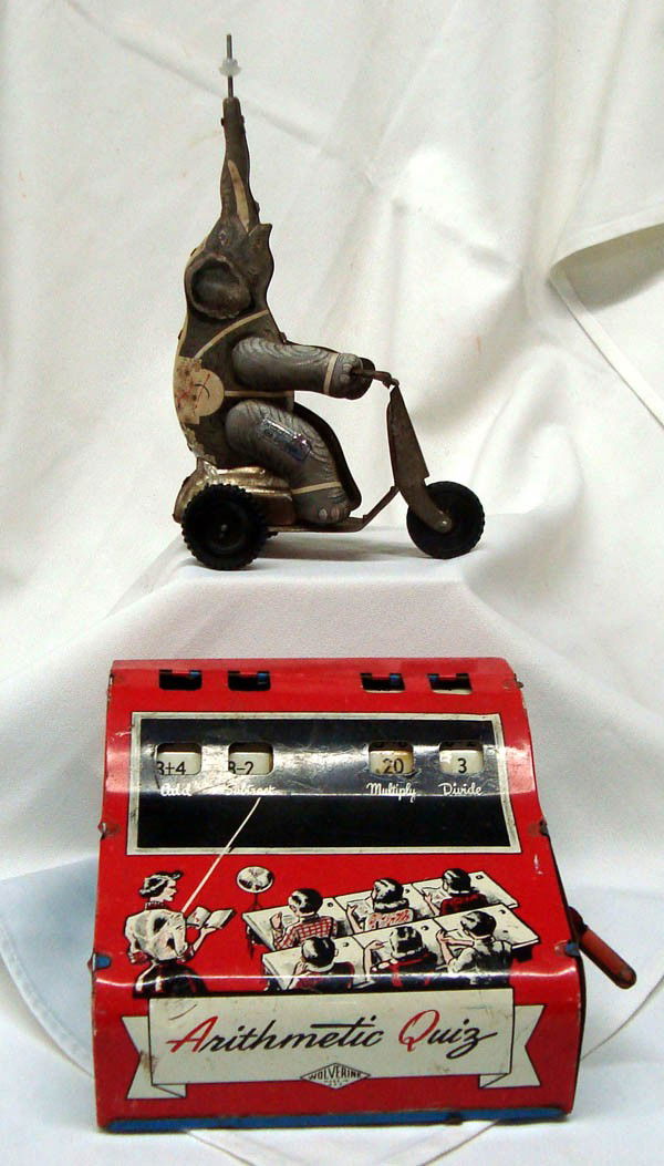 Vintage Tin Toys: Two Vintage Tin Toys. First-Elephant Toy with Spinner Top. Rides rotating 3 wheel bicycle. Wind up works reluctantly but wheels do spin. 9.25'' x 5.75''. Some rust for age. Spinner works but ball is m