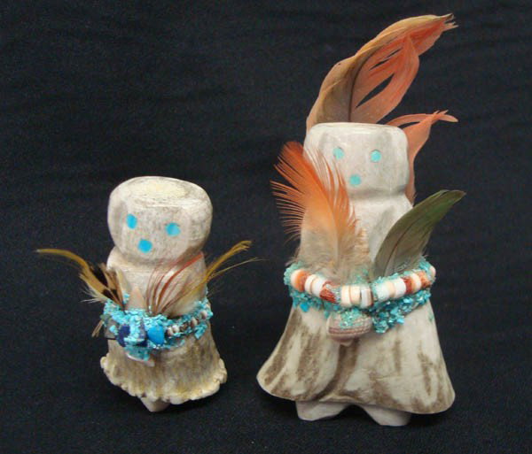 Two Zuni Antler Prayer Dolls, Signed: Two Native American, Zuni Antler Prayer Dolls. Decorated with turquoise chips, Heishi beads, shell and feathers. Turquoise eyes. Sticker says ''Marvelita Phillips''. Tallest is 3''. Buyers Pay Actual