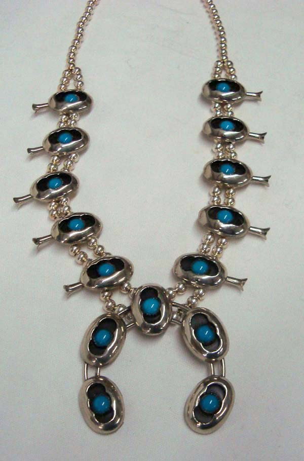 Navajo Sterling Squash Blossom Necklace: Native American Navajo Sterling Squash Blossom Necklace. 24'' neck. 2.5'' x 2.5'' naja shadow box style. Blossoms are 1.25'' x 1.25''. Buyers Pay Actual Shipping and Handling Charges(see terms and con