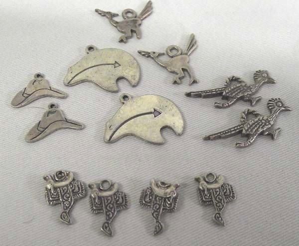 12 Sterling Silver Western Charms: 12 Sterling Silver Western Charms. Roadrunners, saddles, cowboy hat, etc. Largest charm measures approx. 1/2''H x 3/4''W. Buyers Pay Actual Shipping and Handling Charges(see terms and conditions for m