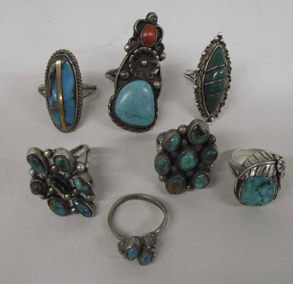 Collection of Navajo Rings-Silver & Turquoise: Collection of Navajo Rings-Silver & Turquoise. One Mexican silver ring, 6 Native American Navajo sterling rings with turquoise, one with turquoise and coral. Largest ring measures 7 1/2. Buyers Pay Ac