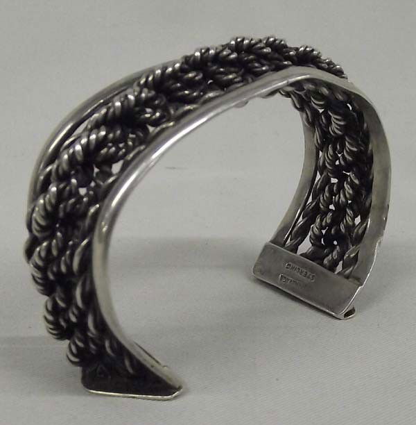 Mexican Sterling Silver Bracelet Hallmark ROCHA: Mexican Sterling Silver Bracelet Hallmark ROCHA. Measurement in Inches - Inside Length(Including Opening)6 3/4'' x 3/4'' Width. Stamped "Hecho En Mexico" "Rocha", "Cuernavaca Sterling". Buyers Pay Act