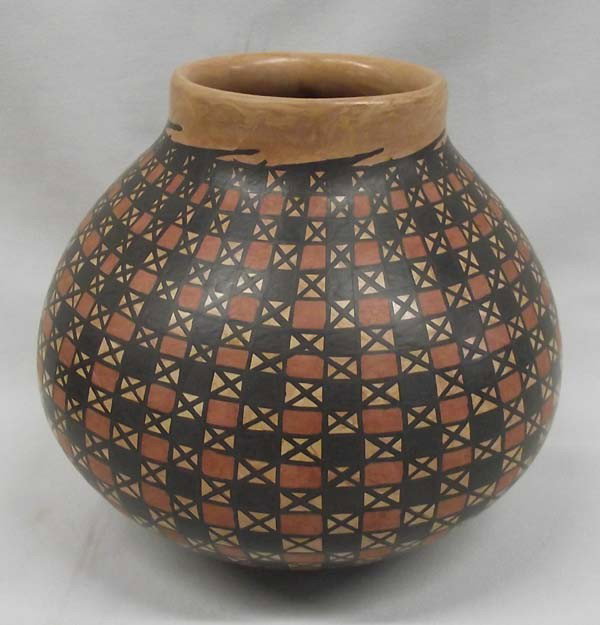 Mata Ortiz Eye Dazzler Pottery - Tito Enriquez: PUEBLO: Mata Ortiz ETHNICITY: Mexican DESCRIPTION:Lovely Eye Dazzler Pottery with Rust and Black on Marbelized background. Marbelized clay is derived by combining 2 different colors of clay. Signed by