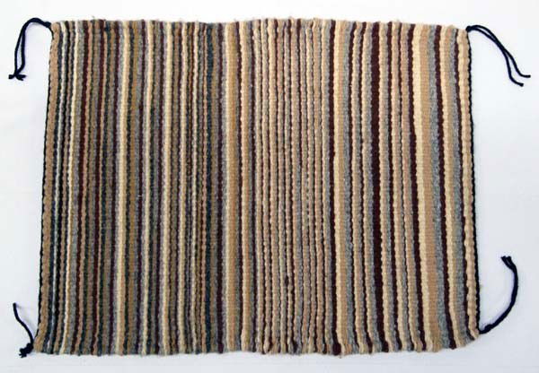 Navajo Sampler Crystal Rug: PUEBLO: Navajo ETHNICITY: Native American DESCRIPTION: All handspun vegetal natural dye wool rug. SIZE: Measures 17''x13''. Buyer pays actual shipping and handling charges. (see terms and conditions f