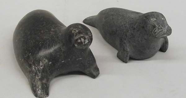 2 Eskimo Seal & Walrus Stone Carvings: PUEBLO: Eskimo ETHNICITY: Native American DESCRIPTION: Heavy nice Soapstone Seal and Walrus Carvings. Walrus has ID numbers on the bottom. SIZE: Seal is largest piece and measures approx. 2 1/3''H x 6