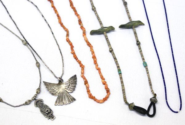 Vintage Navajo Sterling Necklaces: 9 Necklaces, Fetish, Kachina, Turquoise & Coral plus 1 fetish eye glass holder. Total of 10 pices. 2 Fetish chokers, 1 necklace of peach shell, 1 necklace lapis heishi, 1 liquid silver & turquoise nug