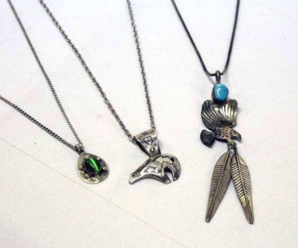 Navajo Sterling Silver Pendant Necklaces: PUEBLO: Navajo ETHNICITY: Native American DESCRIPTION: 1. Striking necklace with turquoise nugget with sterling silver eagle and 2 feathers, marked ''Sterling'' ''LAN'', neck chain measures 23'', eagl