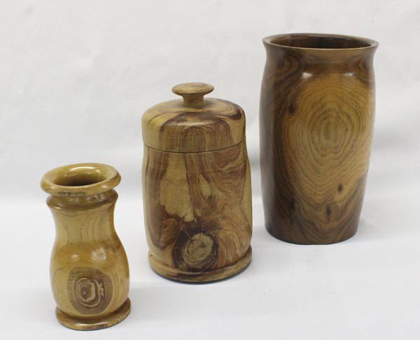 Turned Wood Containers: 3/Turned Wood Containers. Beautifully matched grain and burl. One container has a lid, the other 2 are open. Bottoms are covered in felt for shelf protection. Largest piece measures 8 1/2'' x 4 7/8''.