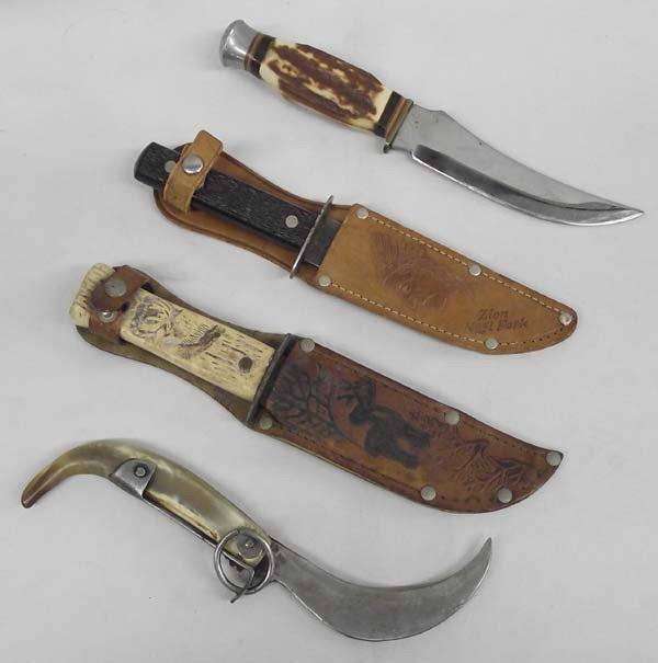 4 Vintage Hunting Knives: AGE: Vintage DESCRIPTION:4 vintage hunting knives. One knife is marked ''Japan'' on the blade and measures approx. 9'' long. Two knives have leather scabbards. One looks very old with carved Elk or Mo