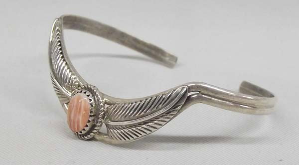 Navajo Sterling Red Shell Cuff Bracelet - G. Perry: PUEBLO: Navajo ETHNICITY: Native American DESCRIPTION: Very pretty feather design with red shell set in sterling silver. Marked on the back ''Sterling, G. Perry''. SIZE: Measurement in inches - Inside