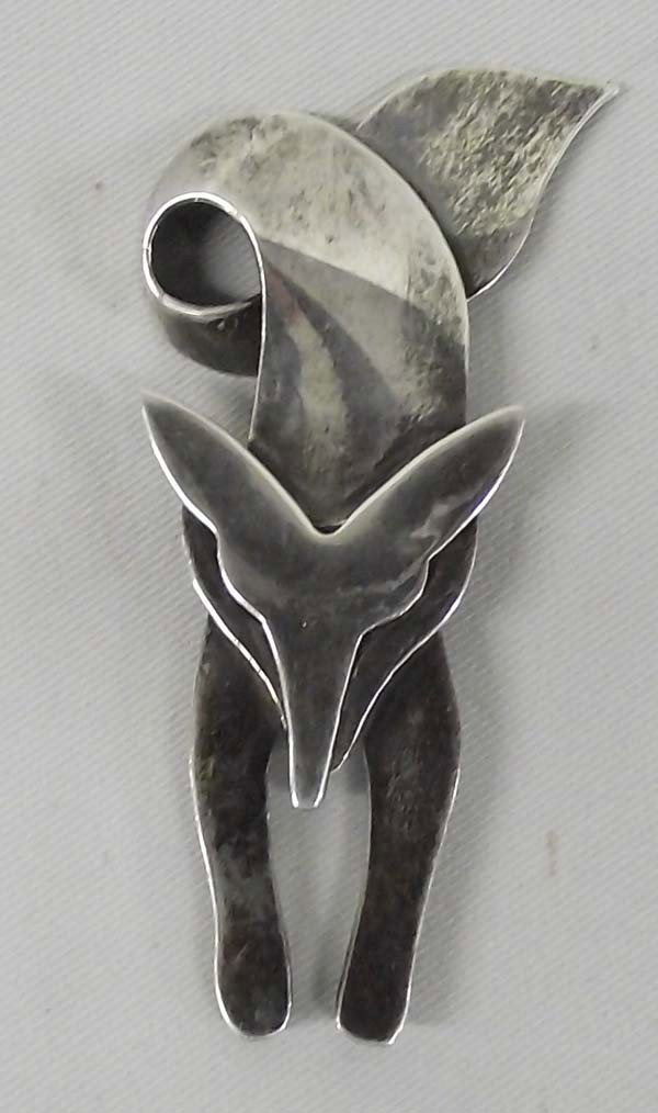 Mexican Taxco Sterling Silver Fox Pin: ETHNICITY: Mexican DESCRIPTION: Charming sly fox sterling silver pin. Stamped on the back, ''925 TB-82 MEXICO''. SIZE: 2.75''Lx1.25''W. Buyer pays actual shipping and handling charges. (see terms and 