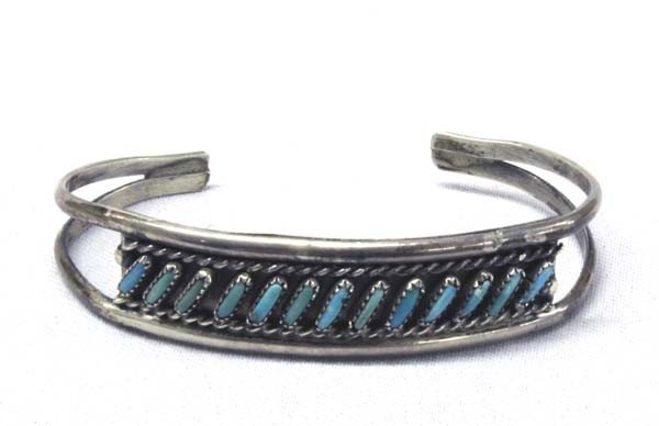 Vintage Zuni Sterling Turquoise Bracelet - FTC: DATE: Vintage PUEBLO: Zuni ETHNICITY: Native American DESCRIPTION: Delicate, very fine needlepoint turquoise on sterling silver. Rope design along top and bottom of turquoise. Signed on the back in sc