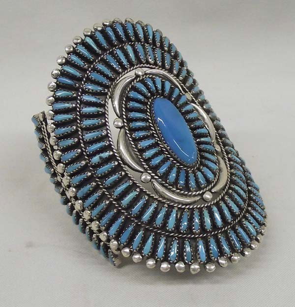 Navajo Sterling Turquoise Bracelet - W. Begay: PUEBLO: Navajo ETHNICITY: Native American DESCRIPTION: Amazing Petit Point Turquoise cluster cuff Bracelet. Signed on the back ''W. Begay'' for William Begay. Beautiful matching stones. SIZE: Measurem