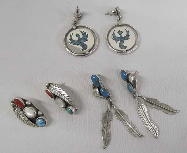3 Pr Navajo Sterling Turquoise Pierced Earrings: PUEBLO: Navajo ETHNICITY: Native American DESCRIPTION: 3 Pair Sterling Silver Pierced Earrings. One pair has turquoise chip inlay and has a flip disk design, with a Roadrunner on one side and Phoenix 