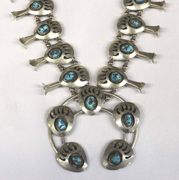 Navajo Squash Blossom Shadow Box Necklace: PUEBLO: Navajo ETHNICITY: Native American DESCRIPTION: Fantastic Navajo Turquoise Bear Paw design. Shadow box squash blossoms and Naja are German Silver. The beads are solid Sterling Silver. Sterling 