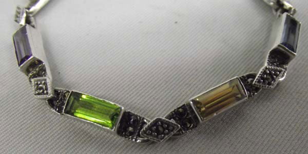 Vintage Marcasite Sterling Silver Tennis Bracelet: DESCRIPTION: Sterling silver set with amethyst, peridot, topaz. SIZE: 7'' end to end. Rectangular beads are 3/8'' long.