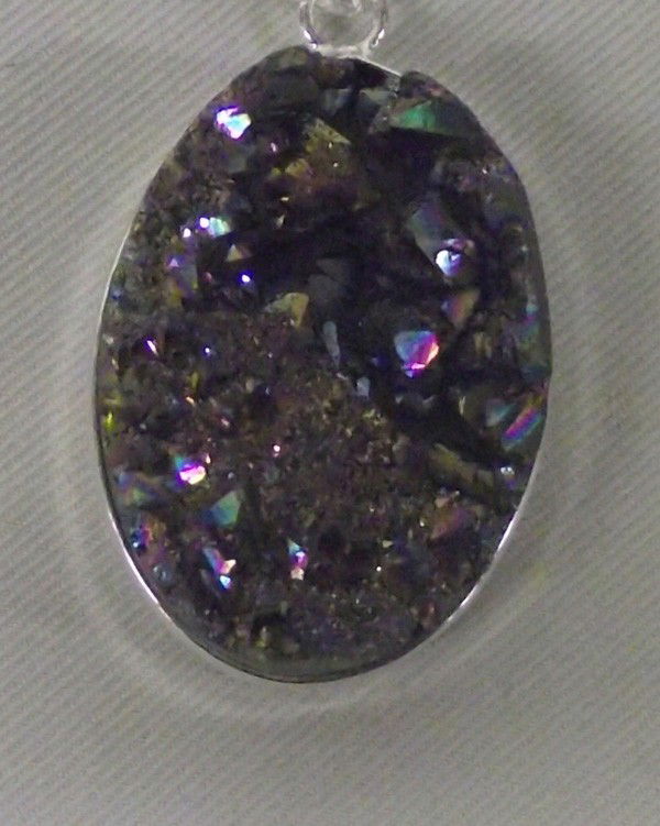 Sterling Titanium Peacock Druzy Pendant Necklace: DESCRIPTION: Large, sparkling titanium Peacock druzy pendant in sterling silver setting with sterling chain. SIZE: Chain is 24'' end to end and pendant is 1''Lx7/8''W.