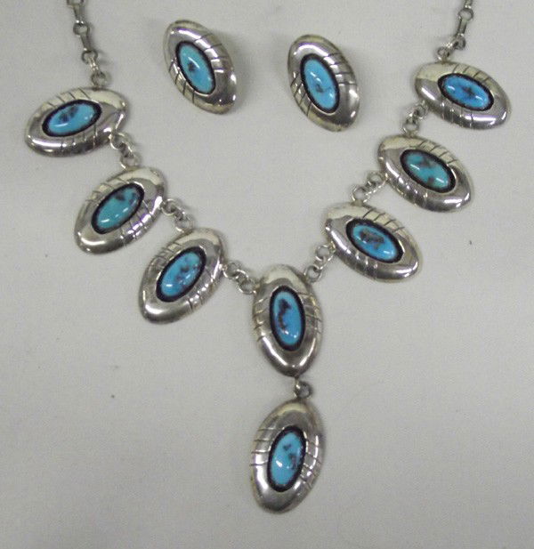 Navajo Sterling Turquoise Necklace and Earrings: ETHNICITY: Native American DESCRIPTION: Eight oval turquoise polished stones in shadowbox silver concho frames. Pierced post earrings match. Hallmarked ''P Sterling'' on both earrings and necklace. SI