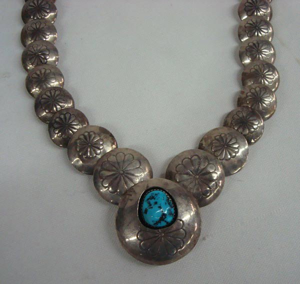 1960s Navajo Sterling Hollow Bead Necklace: ETHNICITY: Native American DESCRIPTION: Graduated sterling flat hollow stamped bead necklace with turquoise shadow boxed pendant. Some beads are dented, but add to the character of the piece. Stamped 