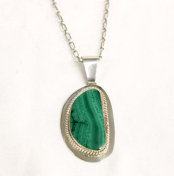 Sally Rocks Sterling Malachite Pendant Necklace: DESCRIPTION: Sterling silver chain necklace with a large malachite cabochon set in sterling silver. Made by Noted Silver City, NM artist, Sally Hansen (Sally Rocks). Stamped on the back, ''925''. SIZE