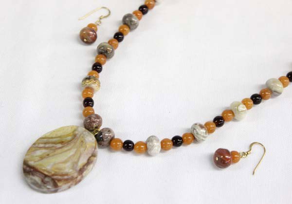 Sally Rocks Multi Stone Necklace & Earrings: DESCRIPTION: Polished round stone beads of jasper, carnelian, garnet. The pendant is New Mexico ryolite (also known as ''candy rock''). Local Noted Silver City, NM artist, Sally Hansen, (Sally Rocks) 