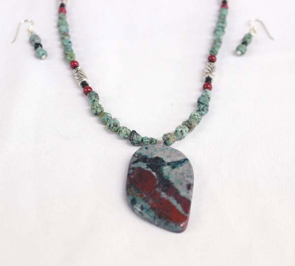 Sally Rocks Silver Turquoise Necklace & Earrings: DESCRIPTION: Necklace includes turquoise nuggets, silver, coral and onyx beads and a large Sonoran Sunset cabochon. The cab comes from northern New Mexico where it is difficult to find high quality st