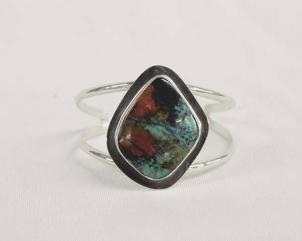 Sally Rocks Sterling Silver Sonoran Sunset Bracelet: DESCRIPTION: Stunning Sonoran Sunset cabochon has rich turquoise, black and rusty red colors. This stone is from northern New Mexico where high quality stones such as this one are becoming very diffic