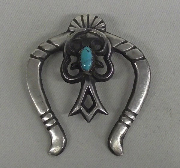 1960 Navajo Sand Cast Sterling Naja Hallmark: AGE: 1960 ETHNICITY: Native American DESCRIPTION: Lovely 1960 Navajo Sand Cast Sterling silver Naja. Hallmark ''JB''. Turquoise Nugget. SIZE: Measures approx. 2 7/8''L x 1 3/8''W.