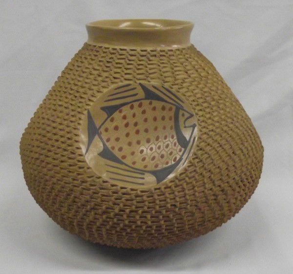 Mata Ortiz Textured Fish Pottery - Jose Gonzalez: PUEBLO: Mata Ortiz ETHNICITY: Mexican DESCRIPTION: Large pottery with textured design and four indented circles with fish figures inside. Black and red color on natural tan background. Signed on the b