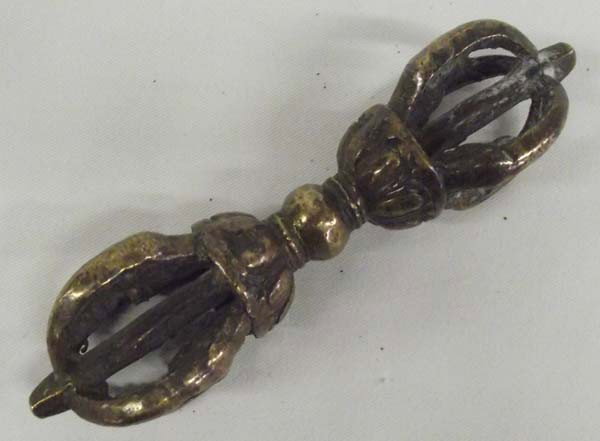 Tibetan Thunderbolt Dorje - Brass Ritual Object: ETHNICITY: Asian DESCRIPTION: This brass object has symbolic meaning in Buddhist and Hindu philosophies. It is held in the Buddha's right hand and is representative of the ''thunderbolt'' moment of th