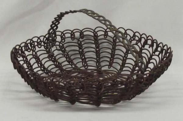 Vintage Papago Woven Wire Folk Art Basket: DESCRIPTION: Vintage Papago Native American Woven Wire Basket. Intricate flower pattern in bottom. Also has wire handle. SIZE: 4''Hx9''W.