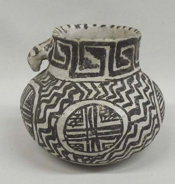 Prehistoric Tularosa Black on White Dog Handle Jar: AGE: Prehistoric PUEBLO: Tularosa ETHNICITY: Native American DESCRIPTION: As found, crisp clear colors. Wonderful un-restored jar with lightning bolt designs on main body and four medallion designs. I