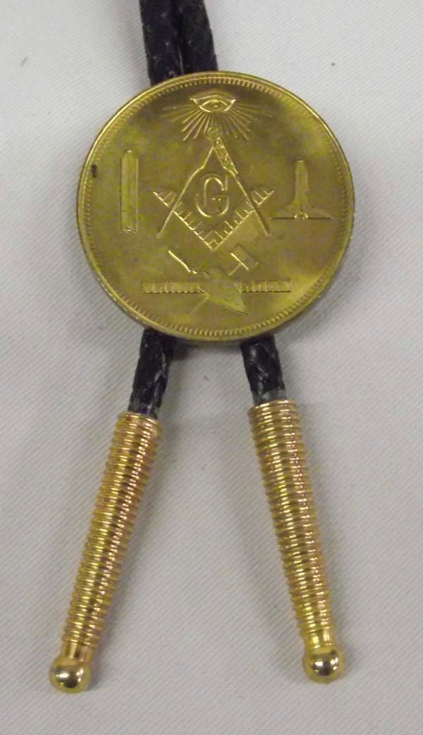 Aztlan Lodge Masonic Centennial Coin Bolo Tie: Date: 1966 DESCRIPTION: Masonic Coin Bolo Tie, on front of slide it has the Masonic Symbols (3 working tools of all 3 degrees and the Masonic Eye) The Masonic Eye is symbolic of the Eye of God. It is 
