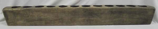 Antique Mexican Wood Pilloncillo Sugar Mold: AGE: Antique ETHNICITY: Mexican DESCRIPTION: Lovely antique Mexican Mesquite wood sugar mold or candelabra. Has 12 holes for making sugar molds or will hold candles. Originally used to form liquid sug