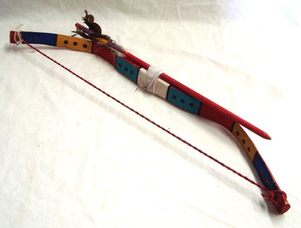 Hopi Child's Bow and Arrow Set: Native American Hopi Child's Bow and Arrow Set. Bow is 18.5'' L x 3.25'' W. The arrow is 14''L. Feathers are worn. A gift any little boy or girl would love.