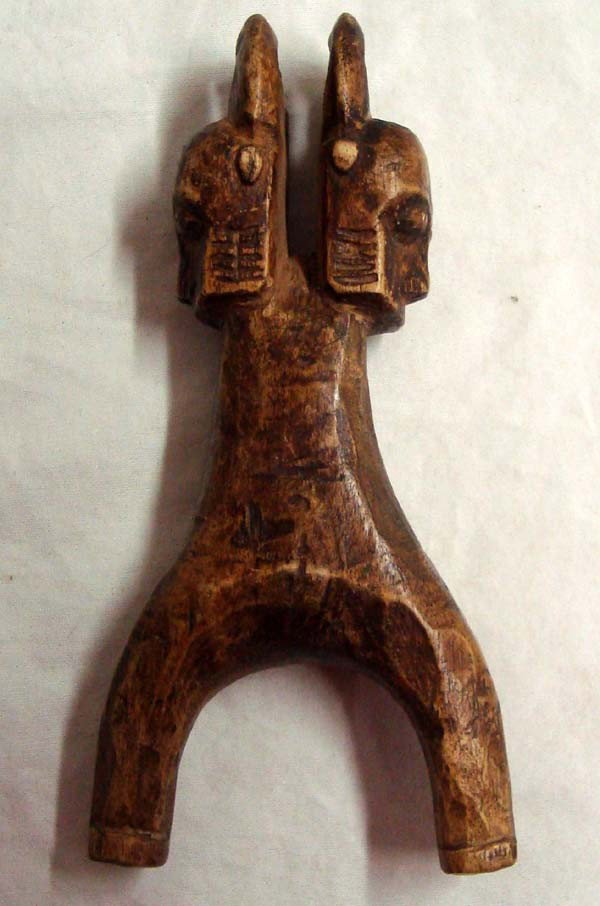 Vintage Ashanti Wood Slingshot From Ghana: Vintage Ashanti Wood Slingshot From Ghana. Carved wood, has two horned mask effigies on hand hold. Measures 6''Lx3''W.
