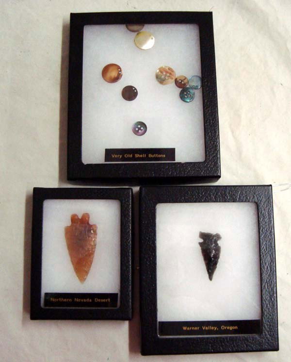 Collection Two Arrowheads and Shell Buttons: Collection Two Arrowheads and Shell Buttons. The black arrowhead is from Warner Valley, OR and the brown one is from Northern Nevada Desert. It is 2.25''Lx1''W. The old shell buttons are beautiful irr