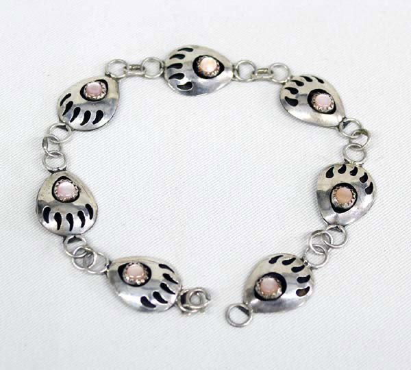 Navajo Bear Paw Silver Chain Bracelet: Navajo Bear Paw Silver Chain Bracelet. Shadow box bear paws with a pink shell cab in the center Measures 8.5'' end to end x 1/2'' wide.
